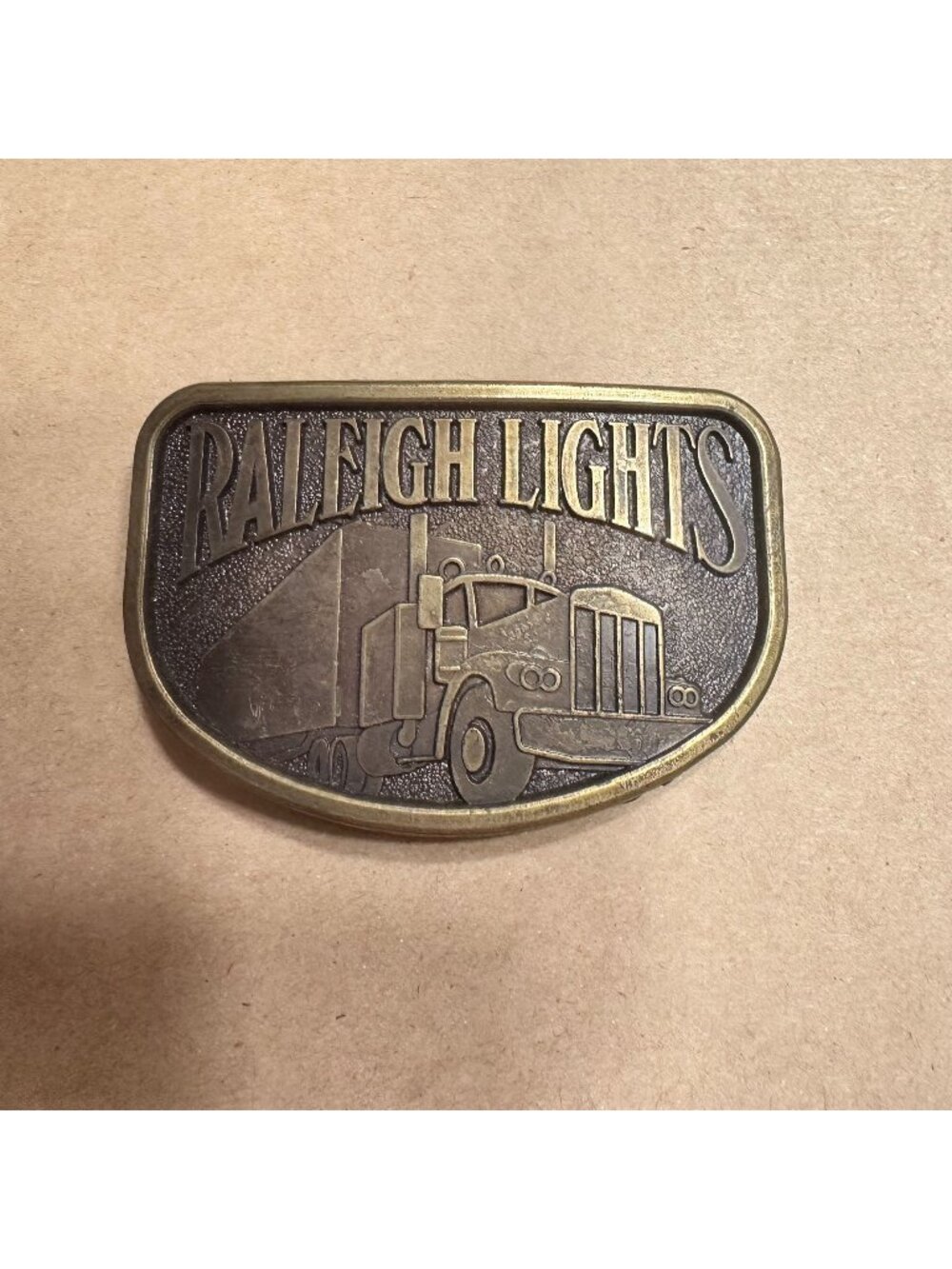 Vintage Raleigh Lights Brass Belt Buckle With Semi Truck Design